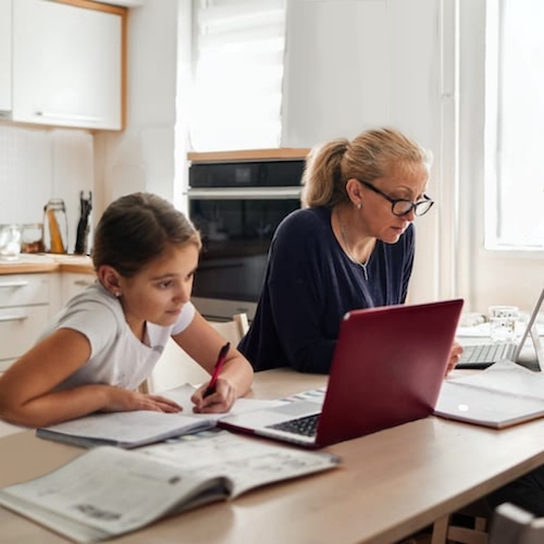 woman working next to kid